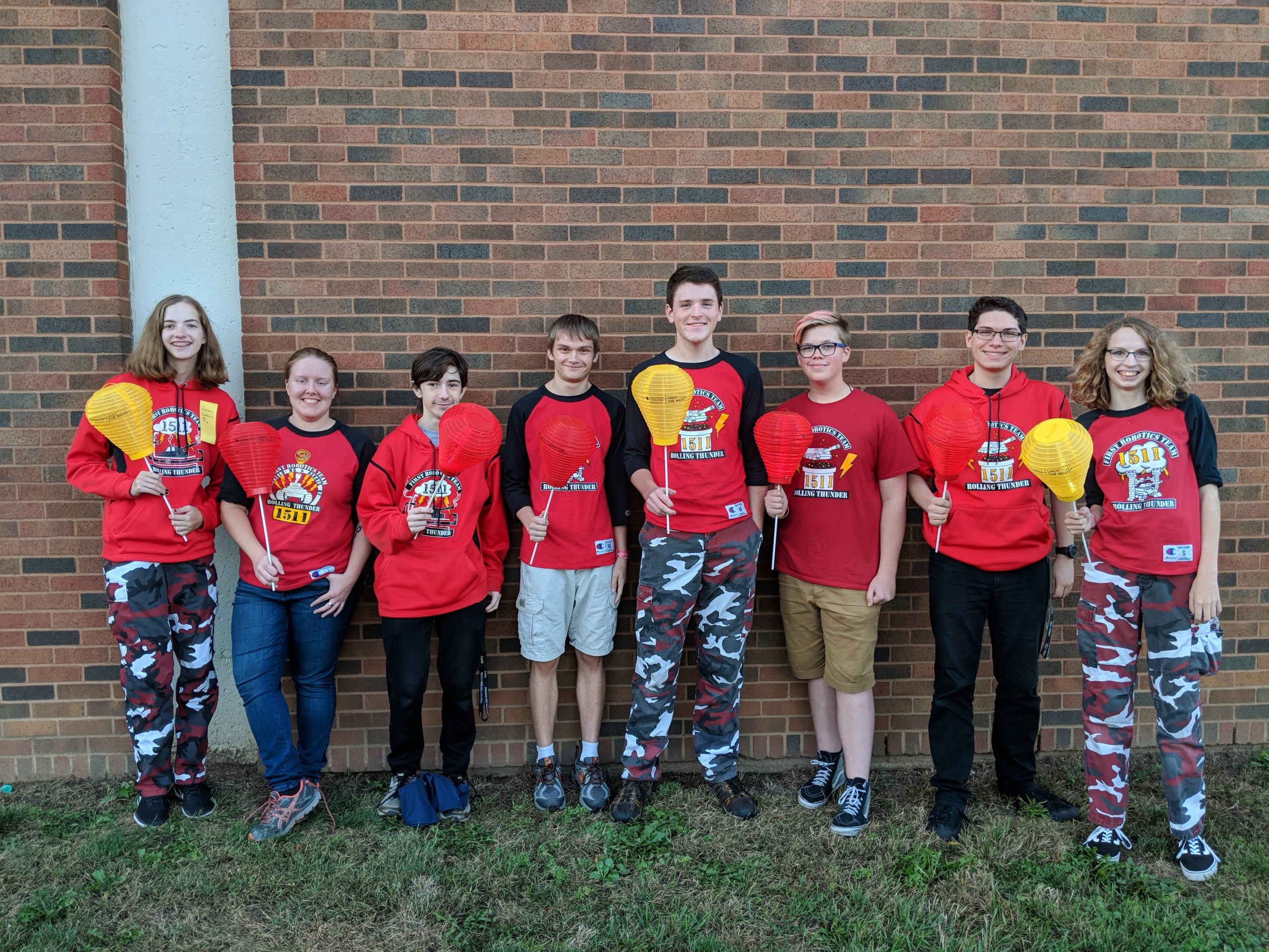 Team members holding lanterns at Light the Night Walk